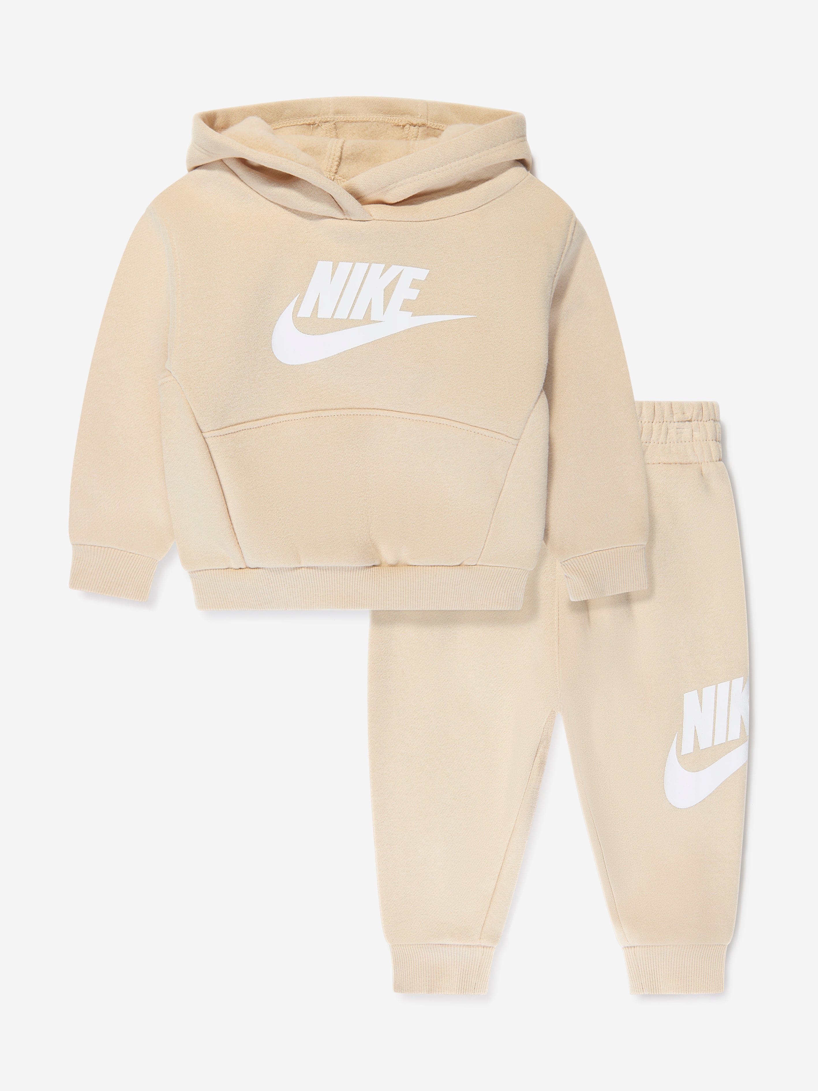 beige nike tracksuit junior